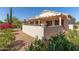 Fully fenced in back yard area with flowering bushes and desert landscaping at 17108 N Estrella Vista Dr, Surprise, AZ 85374