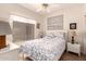 Bright bedroom featuring a ceiling fan, artwork, and plush bedding at 17108 N Estrella Vista Dr, Surprise, AZ 85374