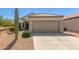 A single-story home featuring a desert landscape, tile roof, and a two-car garage in a sunny location at 17108 N Estrella Vista Dr, Surprise, AZ 85374