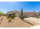 A single-story home featuring a desert landscape, tile roof, and a two-car garage in a sunny location at 17108 N Estrella Vista Dr, Surprise, AZ 85374