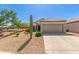 Charming single-story home featuring a desert landscape, tile roof, and a two-car garage in a sunny location at 17108 N Estrella Vista Dr, Surprise, AZ 85374
