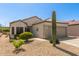 A single-story home featuring a desert landscape, tile roof, and a two-car garage in a sunny location at 17108 N Estrella Vista Dr, Surprise, AZ 85374