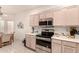 This kitchen features modern appliances, ample cabinet space, and an open design to the dining area at 17108 N Estrella Vista Dr, Surprise, AZ 85374