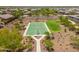 Aerial view of a basketball court amidst desert landscaping, offering an active recreational space at 17652 W Fetlock Trl, Surprise, AZ 85387