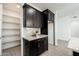 Kitchen featuring ample cabinet space, granite countertops and a convenient walk-in pantry for storage at 17652 W Fetlock Trl, Surprise, AZ 85387