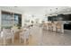 Open-concept living space, seamlessly blending the kitchen, dining, and living areas, with lots of natural light at 17652 W Fetlock Trl, Surprise, AZ 85387