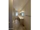 Long bathroom showcasing a double sink vanity, a walk-in shower, and neutral tile floors at 18026 N Cave Creek Rd # 140, Phoenix, AZ 85032