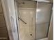Bathroom shower stall with glass door and safety handrail for ease of use at 18026 N Cave Creek Rd # 140, Phoenix, AZ 85032