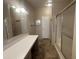 Functional bathroom featuring a large vanity area and a glass shower at 18026 N Cave Creek Rd # 140, Phoenix, AZ 85032