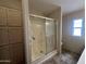 Bathroom with tiled shower and ample storage at 18026 N Cave Creek Rd # 140, Phoenix, AZ 85032