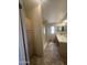Bathroom with shower stall, vanity, tile floor, and storage cabinet space at 18026 N Cave Creek Rd # 140, Phoenix, AZ 85032