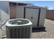Exterior view of home and storage shed with AC unit, offering outdoor space and storage solutions at 18026 N Cave Creek Rd # 140, Phoenix, AZ 85032