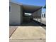Exterior shot of a home showcasing a covered parking area and mature landscaping at 18026 N Cave Creek Rd # 140, Phoenix, AZ 85032