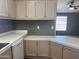 A view of the kitchen with stainless steel sink, counters, and cabinets at 18026 N Cave Creek Rd # 140, Phoenix, AZ 85032