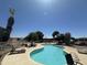 Resort-style community pool surrounded by lush landscaping and comfortable seating at 18026 N Cave Creek Rd # 140, Phoenix, AZ 85032