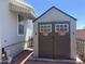 Outdoor storage shed with double doors and flower box accents, providing extra space at 18026 N Cave Creek Rd # 140, Phoenix, AZ 85032