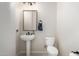 Powder room featuring a pedestal sink, decorative mirror, and tiled flooring at 2030 W Whisper Rock Trl, Phoenix, AZ 85085