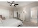 Bedroom with a ceiling fan, closet, dresser and ensuite bathroom at 2030 W Whisper Rock Trl, Phoenix, AZ 85085