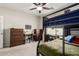 Bedroom featuring a bunk bed and two desks, carpet flooring and a ceiling fan at 2030 W Whisper Rock Trl, Phoenix, AZ 85085