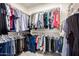 Walk-in closet offers ample storage with organized shelving and hanging space for clothes and accessories at 2030 W Whisper Rock Trl, Phoenix, AZ 85085