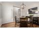 Formal dining room with wooden table set, chandelier, and elegant decor at 2030 W Whisper Rock Trl, Phoenix, AZ 85085