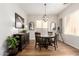 Formal dining room with wooden table set, chandelier, and elegant decor at 2030 W Whisper Rock Trl, Phoenix, AZ 85085