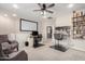 Spacious flex room with large tv screen and two work-from-home desk areas at 2030 W Whisper Rock Trl, Phoenix, AZ 85085