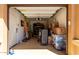 Spacious garage with overhead lighting, storage racks, and various equipment at 2030 W Whisper Rock Trl, Phoenix, AZ 85085