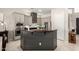 Modern kitchen features stainless steel appliances, gray cabinets, an island with dark countertops, and a breakfast bar at 2030 W Whisper Rock Trl, Phoenix, AZ 85085