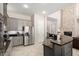 Bright kitchen features stainless steel appliances, gray cabinets, large island, and an open floor plan at 2030 W Whisper Rock Trl, Phoenix, AZ 85085