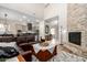 Bright, open living area with a fireplace, and views of the kitchen at 2030 W Whisper Rock Trl, Phoenix, AZ 85085