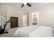 Inviting main bedroom with neutral carpet, ensuite bathroom, walk-in closet, and staircase to upper level at 2030 W Whisper Rock Trl, Phoenix, AZ 85085