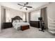 Spacious main bedroom features a king-size bed, dark wood furniture, and a spiral staircase at 2030 W Whisper Rock Trl, Phoenix, AZ 85085