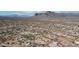 An aerial view highlights this community with desert landscaping and mountain views in the distance at 2242 E 12Th Ave, Apache Junction, AZ 85119