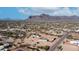 Aerial view showcasing the home, adjacent lots, and mountain views at 2242 E 12Th Ave, Apache Junction, AZ 85119