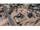 Aerial view of the property showcases desert landscaping, two homes, privacy fencing, and nearby roads at 2242 E 12Th Ave, Apache Junction, AZ 85119