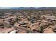 Aerial view of a community displaying numerous homes amid a desert environment at 2242 E 12Th Ave, Apache Junction, AZ 85119