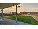 Relax on the concrete patio and enjoy the sunset view of the mountains in this spacious backyard at 2242 E 12Th Ave, Apache Junction, AZ 85119