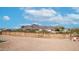 Backyard with desert landscaping and a view of the mountains at 2242 E 12Th Ave, Apache Junction, AZ 85119