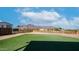 The backyard features a patch of green lawn and a view of the mountains at 2242 E 12Th Ave, Apache Junction, AZ 85119