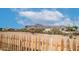 Desert landscaping and a wooden fence surround the property at 2242 E 12Th Ave, Apache Junction, AZ 85119