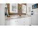 Beautifully designed bathroom showcasing a dual sink vanity with granite countertop and well-lit mirrors at 2242 E 12Th Ave, Apache Junction, AZ 85119