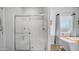 Bright bathroom with a glass-enclosed shower and a soaking tub by the window offering a spa-like feel at 2242 E 12Th Ave, Apache Junction, AZ 85119