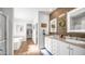 Elegant bathroom featuring double vanity, wood accent wall, and modern fixtures at 2242 E 12Th Ave, Apache Junction, AZ 85119