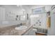 Well-lit bathroom features a decorative shower curtain, updated vanity and countertop, and neutral color palette at 2242 E 12Th Ave, Apache Junction, AZ 85119