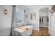 Luxurious bathroom with a freestanding tub, natural light, and walk-in closet at 2242 E 12Th Ave, Apache Junction, AZ 85119