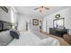 Bright bedroom with a large bed, minimalist decor, and walk-in closet access at 2242 E 12Th Ave, Apache Junction, AZ 85119