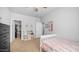 Charming bedroom with a bed, dresser, and a glimpse of an organized closet, offering comfort and functionality at 2242 E 12Th Ave, Apache Junction, AZ 85119