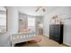 Cozy bedroom featuring a bed, chest of drawers, and cute decorations, creating a welcoming space at 2242 E 12Th Ave, Apache Junction, AZ 85119