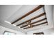 Detailed view of a ceiling with decorative beams and a modern ceiling fan at 2242 E 12Th Ave, Apache Junction, AZ 85119